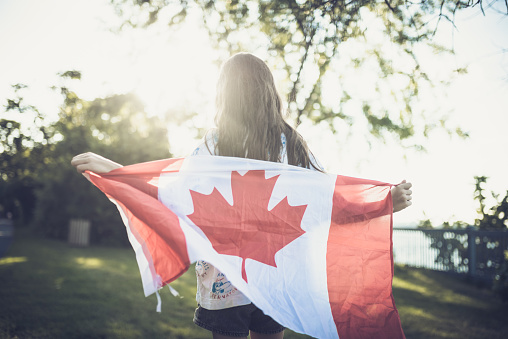 Patriotic Girl covering with  Canadian Flag,