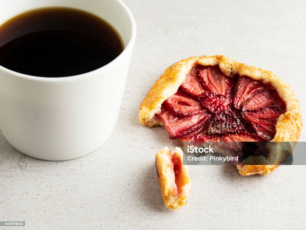 Galette with coffee, Strawberry Galette with coffee, Small Strawberry Tarts Galette, Strawberry tart, Strawberry pie, Mini Galette and coffee Galette, Strawberry, Crostata, Baked, Baked Pastry Item, Food and drink, Sweet Pie, Cake, Tart - Dessert, Baking, Berry Fruit, Dessert - Sweet Food, Food,  Pie, Breakfast, Mini Galette, coffee, tea Baked Stock Photo