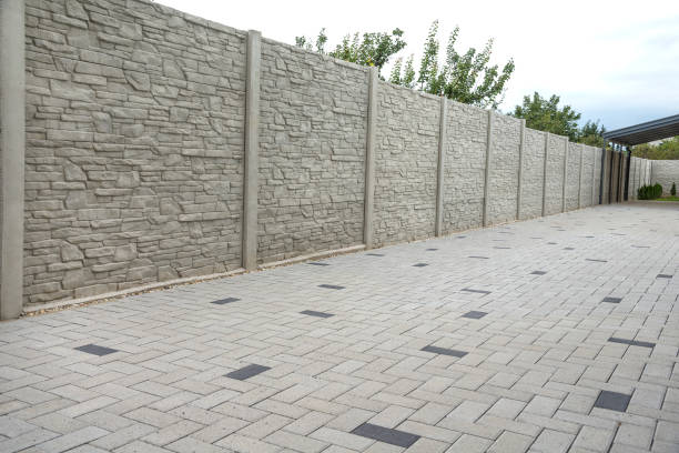 istock Concrete pattern fence and block paving tiles 1421980225