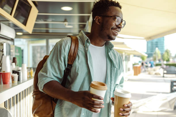 istock Smiling African American man in cafeteria 1421983807