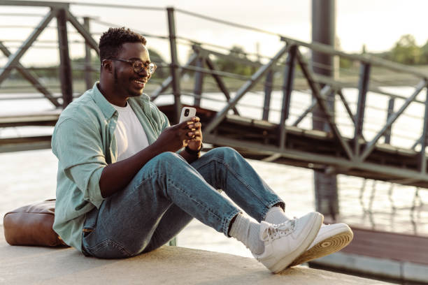 istock African-American man relaxing by the river 1421985062