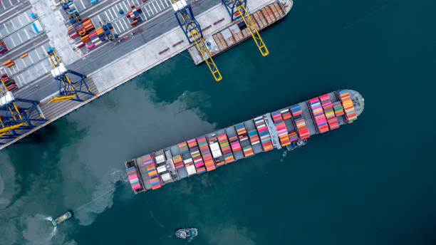 istock Container ship global business company freight shipping import export logistic and transportation by container ship, Container ship cargo freight shipping maritime transport international worldwide. 1421988892