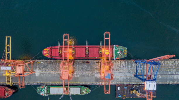 istock Aerial top view large general cargo ship bulk carrier, Bulk carrier dock, Global business import export logistic and transportation company, Commercial dock container cargo vessel freight shipping worldwide. 1421990388