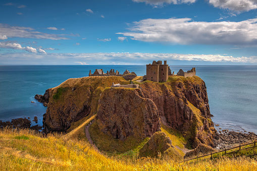 Dunnottar Castle is a ruined medieval fortress located upon a rocky headland on the north-eastern coast of Scotland, about 2 miles south of Stonehaven.