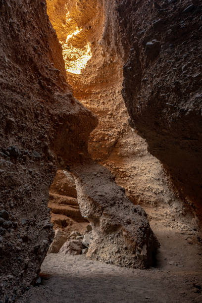 istock Sunlight Begins To Enter Archway Room In Sidewinder Canyon 1421993393