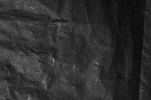 istock Abstract background of black polyethylene film. 1421993565