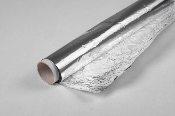 istock Roll of foil on the table close-up. 1421993621