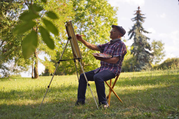 istock Amateur Artist Paints a Picture 1421994546