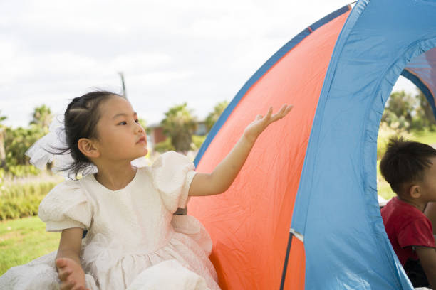 Cute little girl is camping