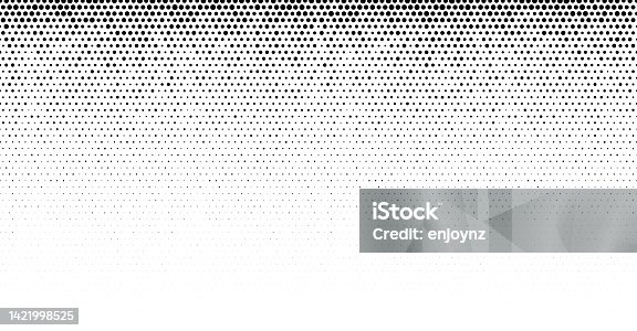 istock Seamless black half tone dots on white background 1421998525