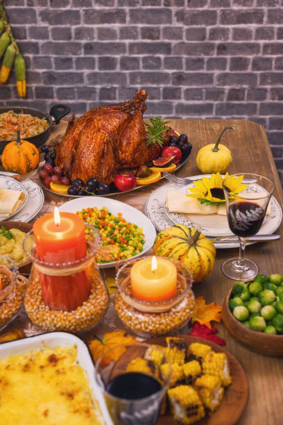 istock Traditional Stuffed Turkey with Side Dishes served for Thanksgiving Celebration 1421999307