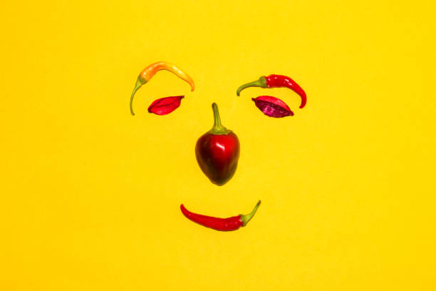 pepper face on yellow background, creative art design, autumnal design
