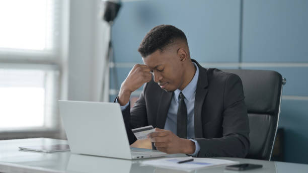 istock African Businessman making Online Payment Failure on Laptop in Office 1422002007