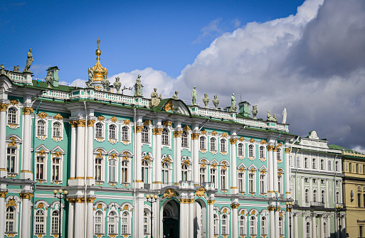 St Petersburg, Russia - August, 2019: The outside of the State Hermitage Museum in Russia on a cloudy summer day. The hermitage is a museum for art and culture, it's currently the largest art museum in the world (gallery size). It was founded in 1764 by Empress Catherine the Great.