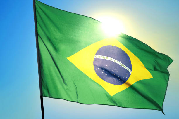 istock Brazil flag on sunny sky background 1422010866