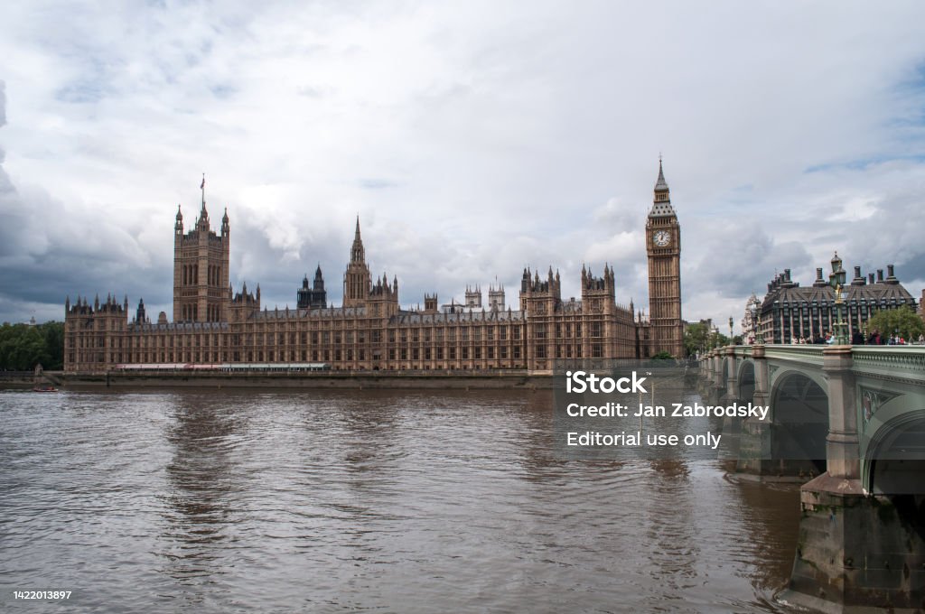 The British Parliament And The Big Bens Clock At The Thames River In