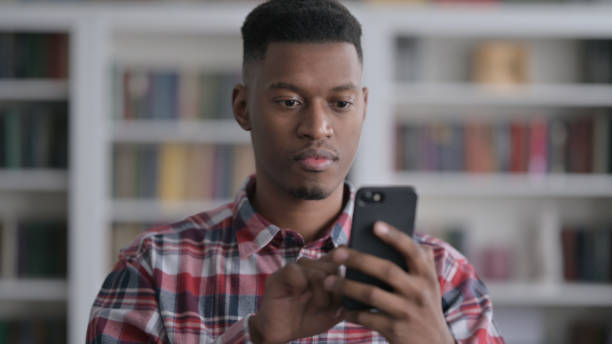 istock Portrait of African Man using Smartphone 1422013926
