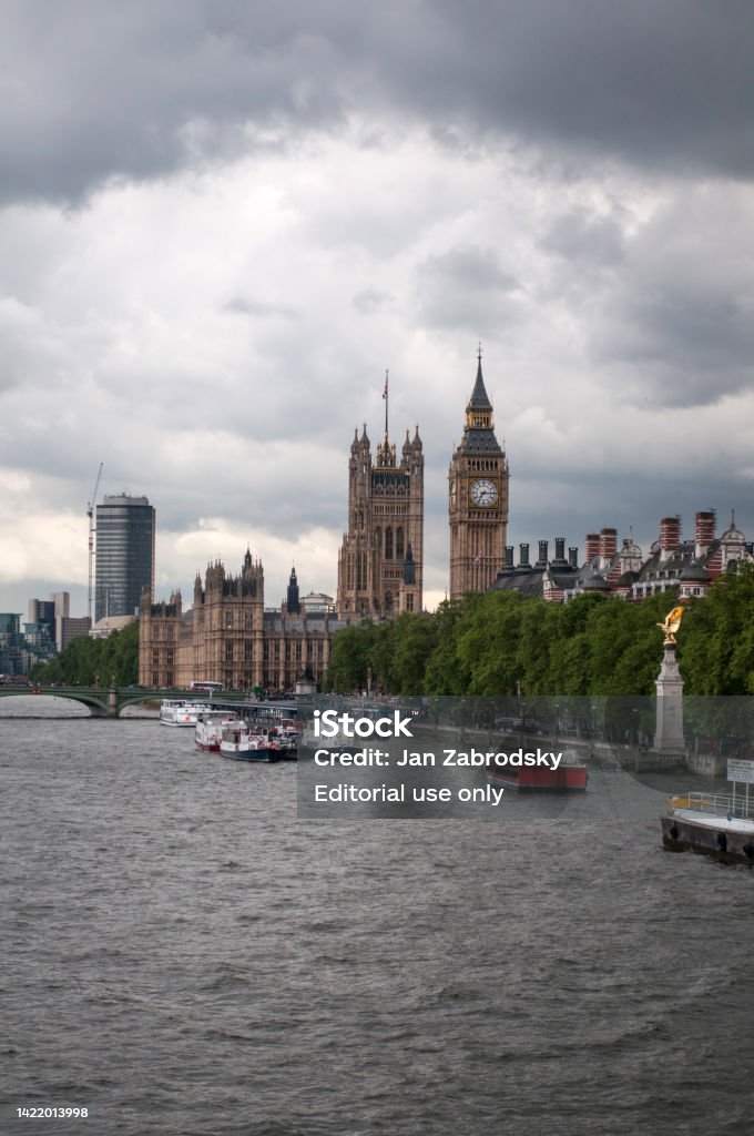The British Parliament And The Big Bens Clock At The Thames River In