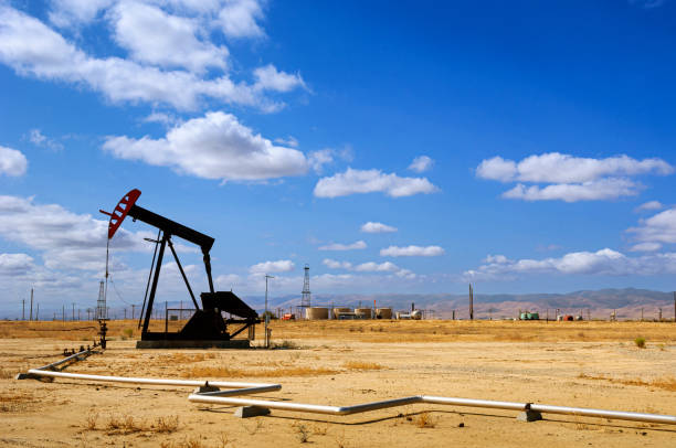 istock Oil Pumpjacks with Clouds in Background 1422017846