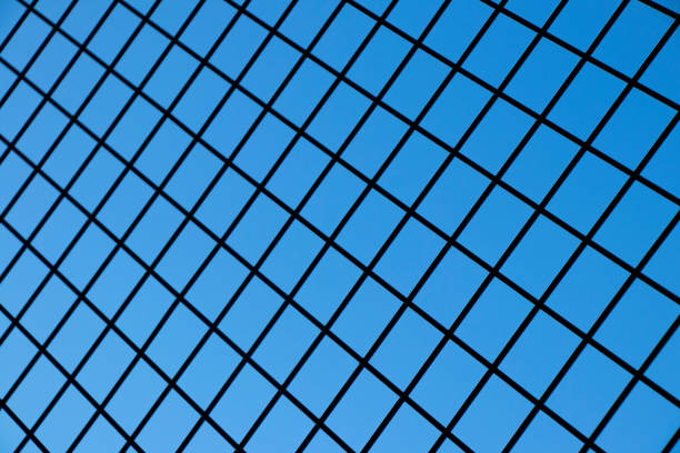 Wire Fence Against Blue Sky Close-up