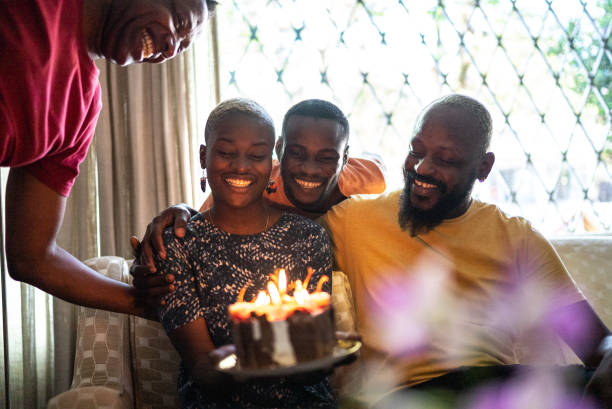 Family celebrating young woman's birthday