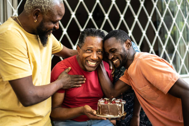 Family celebrating father's birthday