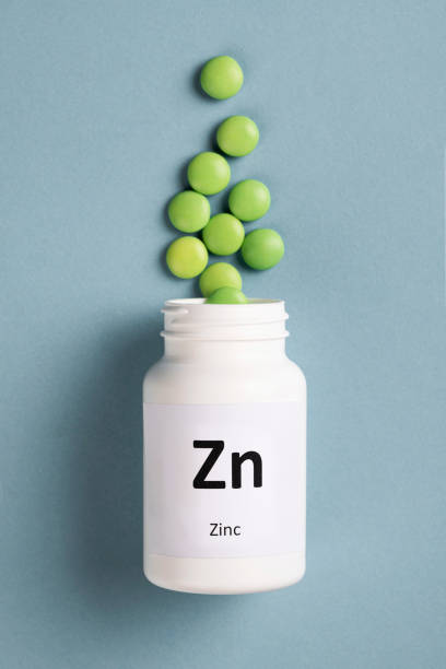 suplemento mineral de zinco - zinc mineral nutritional supplement pill - fotografias e filmes do acervo