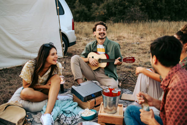 istock Group Of Friends With Guitar 1422030295
