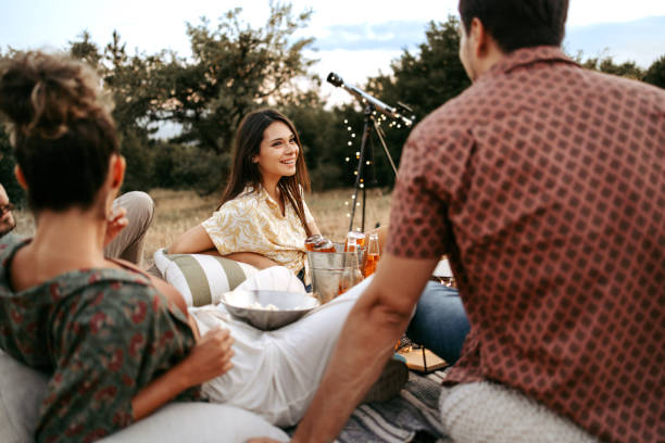istock Group of friends enjoying while camping in the nature 1422030396