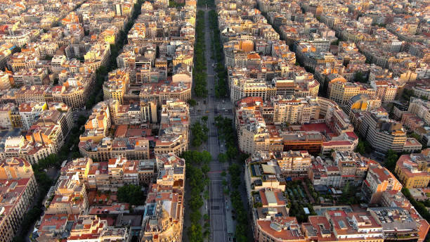 Aerial view of Passeig de Gracia major avenues in Barcelona in summer day at sunrise. Catalonia, Spain This elegant, majestic boulevard was a showcase for Barcelona's bourgeoisie at the turn of the 19th century, and links the Plaça Catalunya with the district of Gràcia, hence its name. avenida diagonal stock pictures, royalty-free photos & images