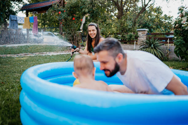 istock Dad and son in the pool 1422034691