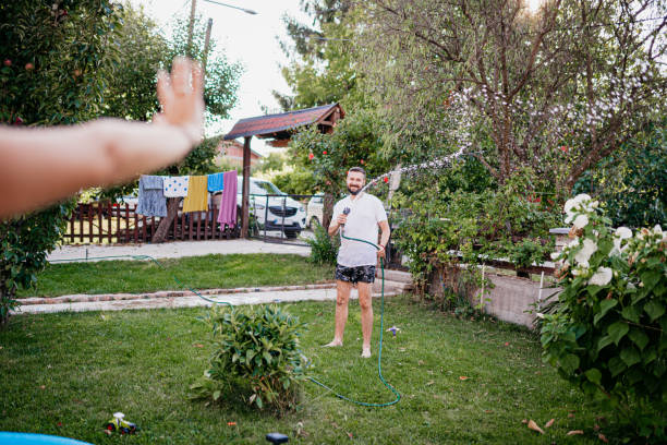 istock Spraying with a hose in the yard 1422034961