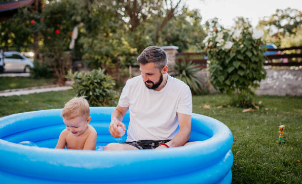 istock Dad is playing in the rubber pool with his son 1422035391