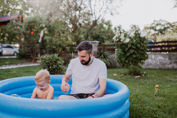 istock Dad is playing in the rubber pool with his son 1422035424