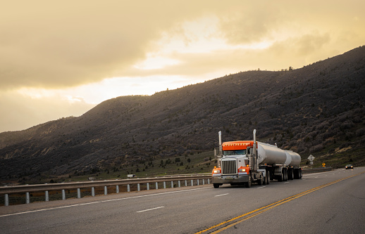 Semi-truck tanker driving on a highway in Utah