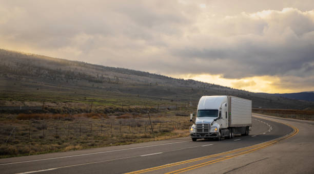 istock White semi transporting merchandising in Utah, USA 1422036150