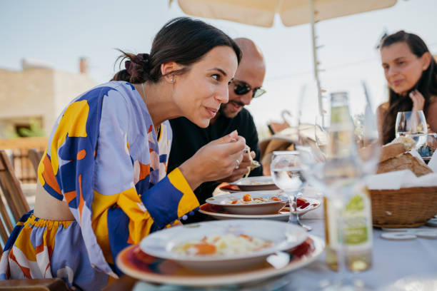 istock Friends enjoy lunch in the yard 1422036184