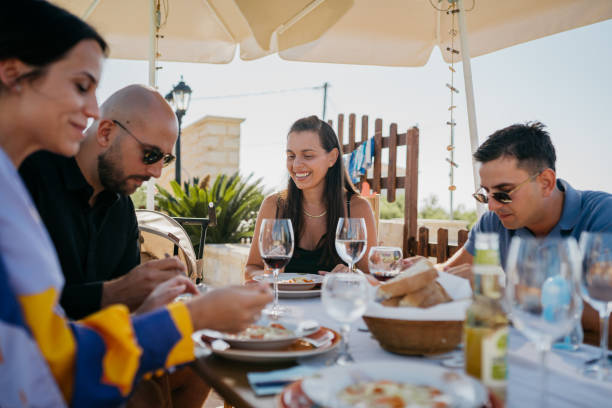istock Friends enjoy lunch in the yard 1422036548