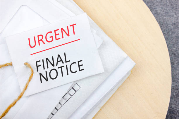 istock Writing note with words URGENT FINAL NOTICE on business mail envelopes.Late Payments. 1422044302