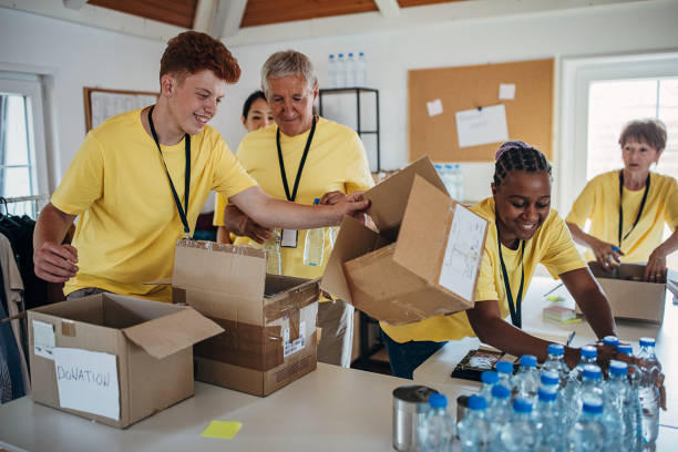 People working for charity together stock photo