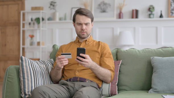 istock Young Man Unsuccessful Online Payment on Smartphone 1422053088