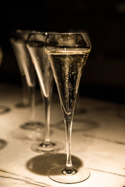 istock set of champagne glasses on table top (golden light bubbly fine wining in a restaurant) 1422053326