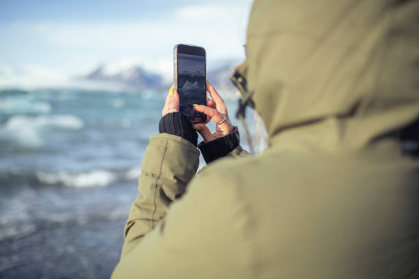 istock An unrecognizable woman takes photos to remember. ISL 1422055192