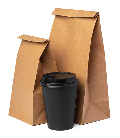 Craft paper bag with coffee cup isolated on white background