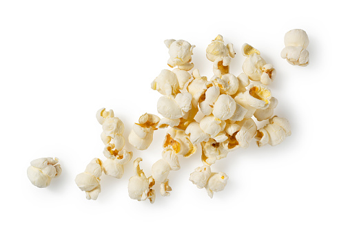 Lots of popcorn on a white background. View from above.