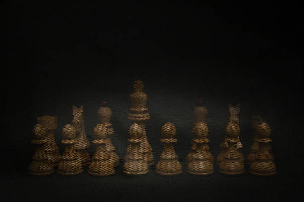 istock Chess pieces under a black veil without queen. 1422070104