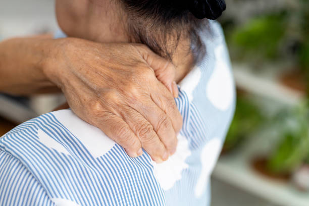 istock Senior woman rubbing sore shoulder 1422076844