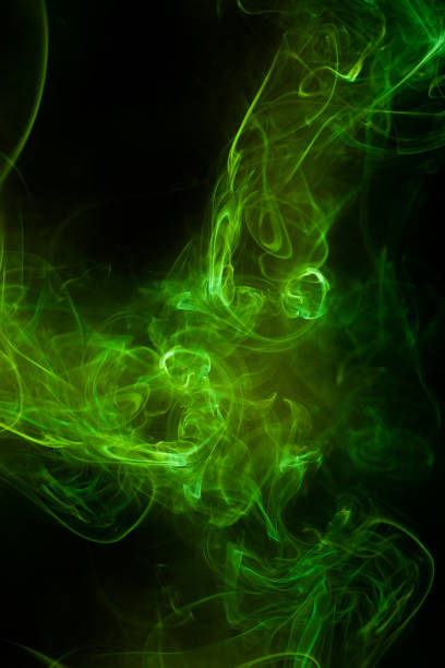 istock Green smoke motion on black background. 1422078117