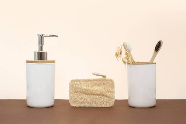 istock Soap dispenser and bamboo toothbrushes, zero waste bathroom concept. Eco friendly daily body care products. 1422078965
