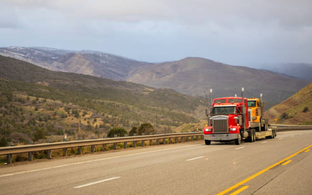 truck on highway and mountains in background